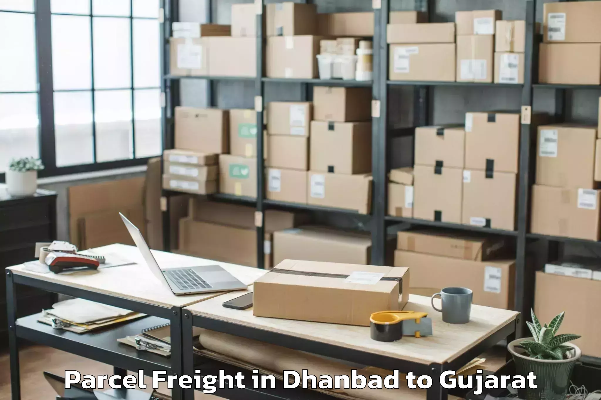 Top Dhanbad to Bedi Parcel Freight Available